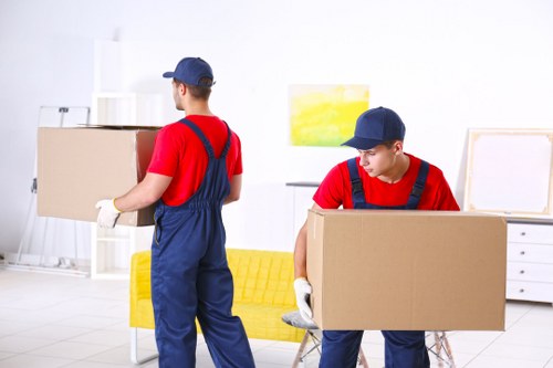 Mover loading boxes from a city apartment in Soho