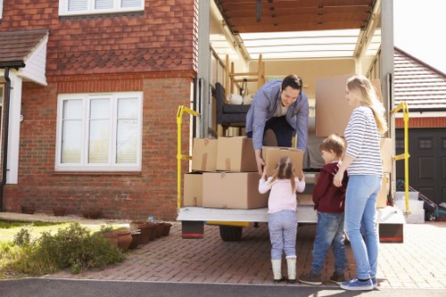 Furniture being carried from a Soho flat with narrow access