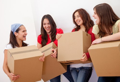 Careful unpacking and room setup in a Soho flat after moving day