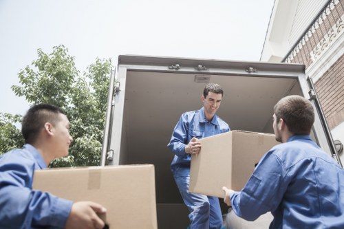 Packing boxes and furniture for a student move in Soho