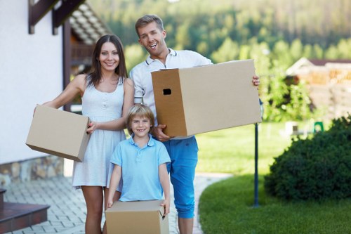 Professional movers loading household items for a Soho relocation