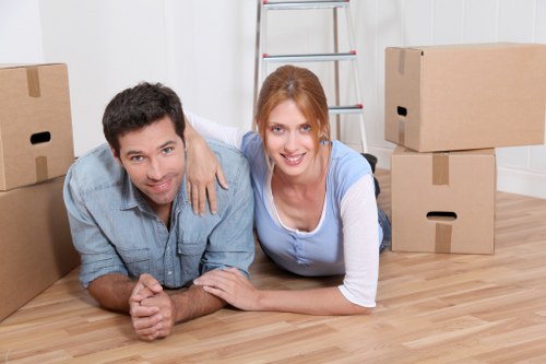 Moving crew managing boxes and furniture with precision