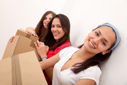 Packed boxes and furniture prepared for a flat move in Soho